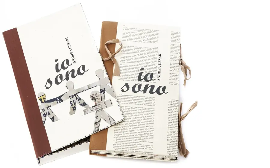 Io Sono, artist's book by Andrea Cesari, two copies with cut paper figures on the covers